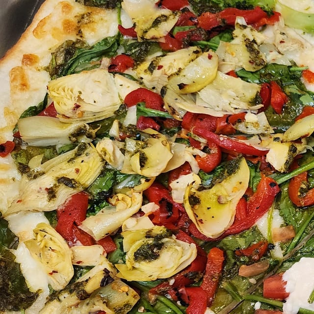 Artichokes, Spinach, Roasted Peppers & Pesto Pizza.